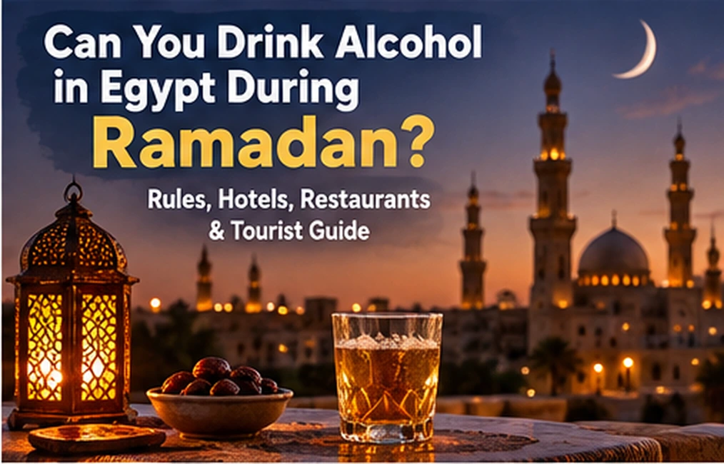 Ramadan lantern, dates and a drink on a table overlooking a lit Cairo mosque at night