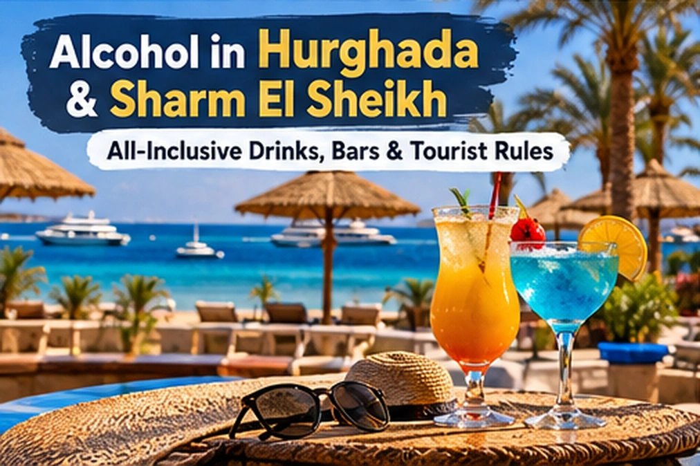 Colorful cocktails on a beach table with umbrellas, palm trees and the Red Sea in Hurghada